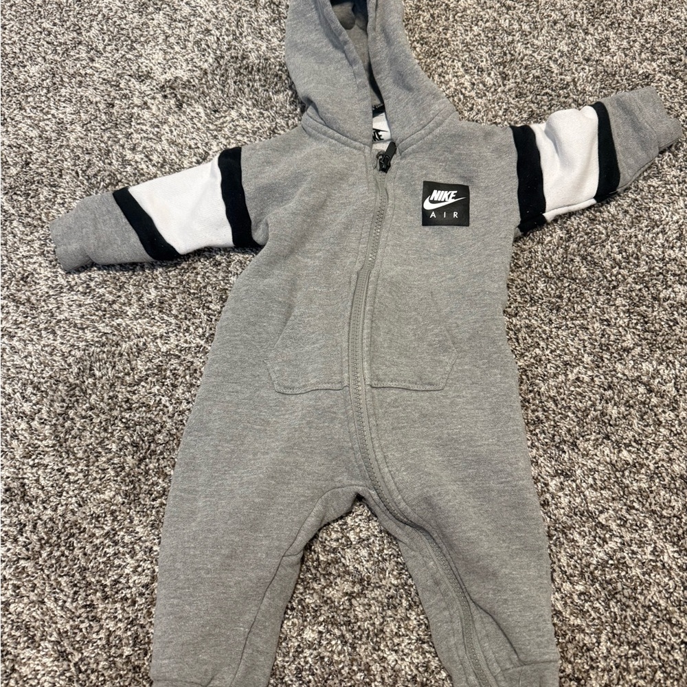 Nike Grey Hooded Baby One-Piece with Black & White Sleeve Stripes